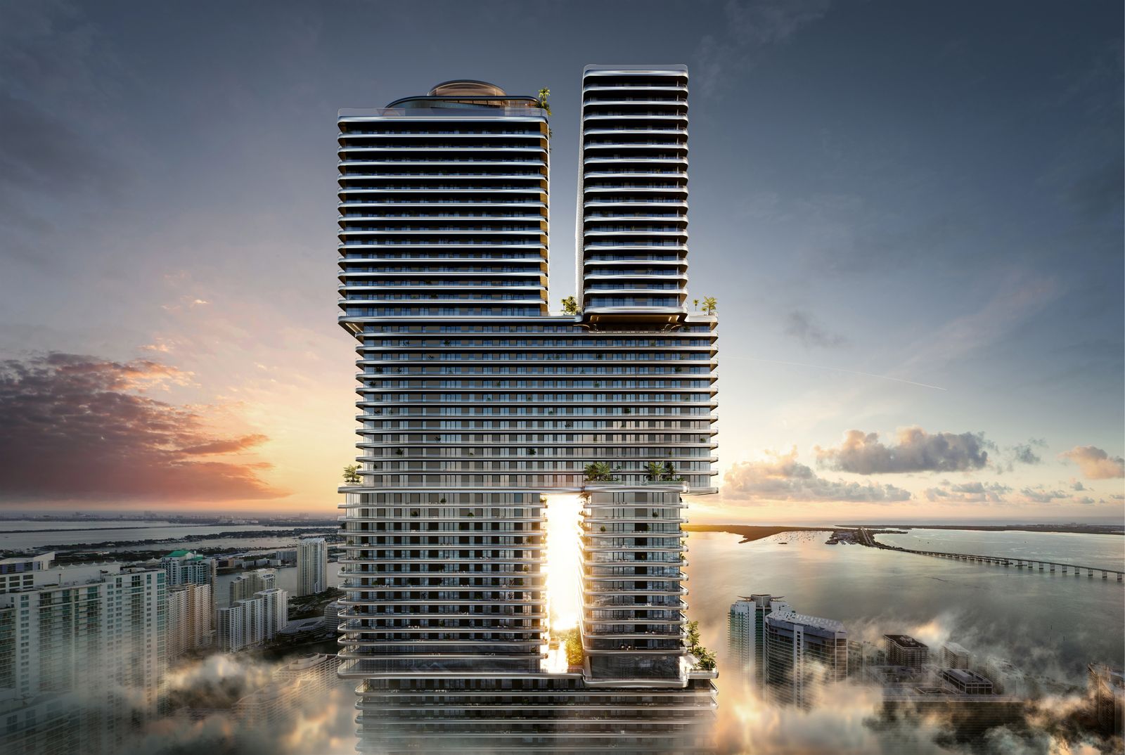 The two towers of Mercedes-Benz Places Miami above the clouds at sunrise, developer rendering